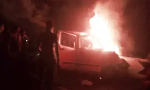 Narrow escape for four as car catches fire on Rajiv Rahadari in Karimnagar