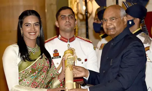 President Ram Nath Kovind presents Padma Bhushan to shuttler PV Sindhu during a ceremony at the Rashtrapati Bhavan in New Delhi on Monday