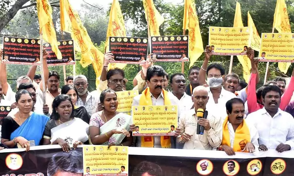Former Central TDP MLA Bonda Umamaheswara Rao, party leaders and activists staging a protest demanding the State government to slash taxes on petrol and diesel in Vijayawada on Tuesday 	Photo: Ch Venkata Mastan