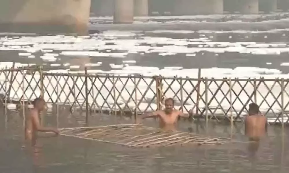 Barricades Being Installed In The Yamuna To Prevent Harmful Foam From Floating