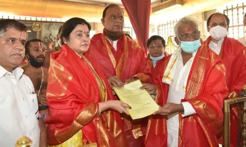TTD chairman Y V Subba Reddy giving appointment letter to newly appointed LAC chairman V Prasanthi Reddy at TTD temple in New Delhi on Wednesday.