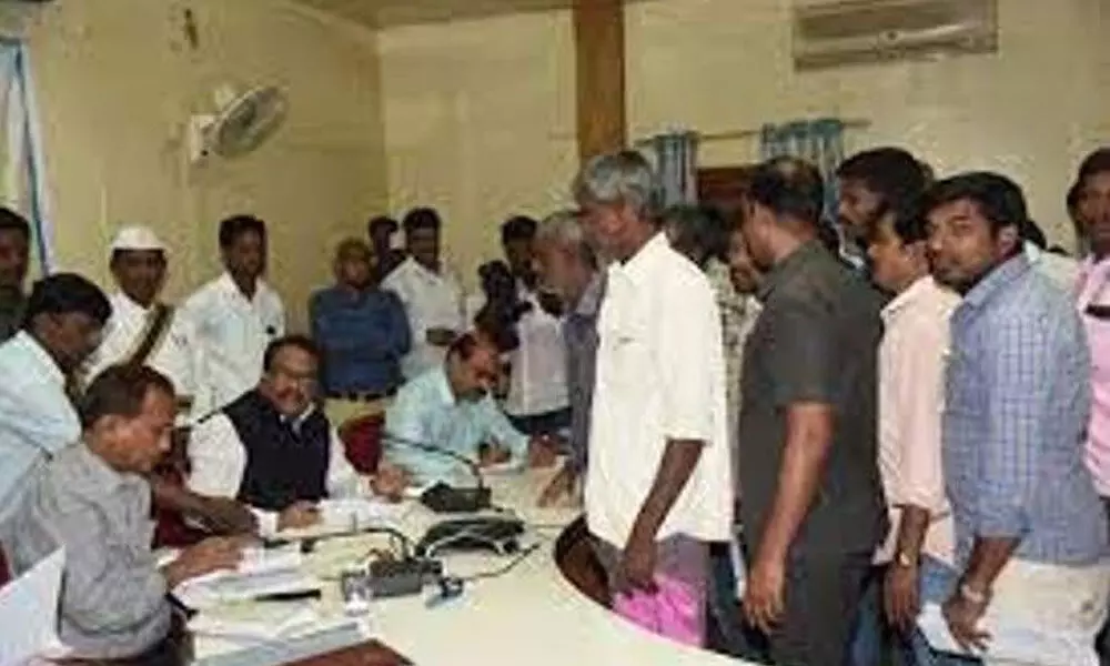 File photo of people submitting their complaints during Prajavani programme at Mahabubnagar Collectorate