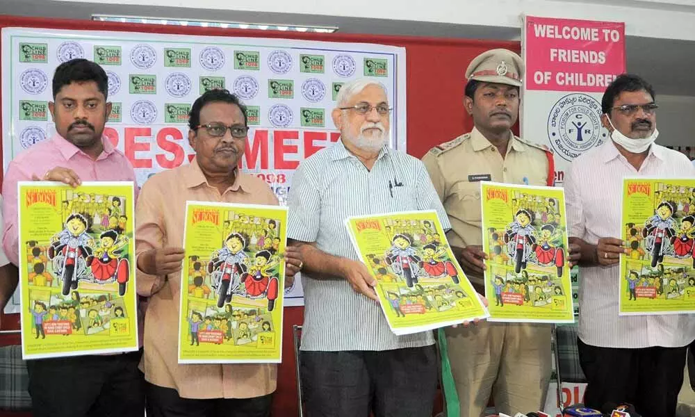 Forum for Child Rights Secretary Noel Harper, Assistant Labour Commissioner Govind, Coordinator Arava Ramesh and others releasing a poster in Vijayawada on Friday