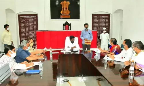 Durga temple executive officer Bhramaramba, along with the officials of the Devastanam, members of Vaidika Committee and others meeting with Sub-Collector GSS Praveen Chand in Vijayawada on Friday