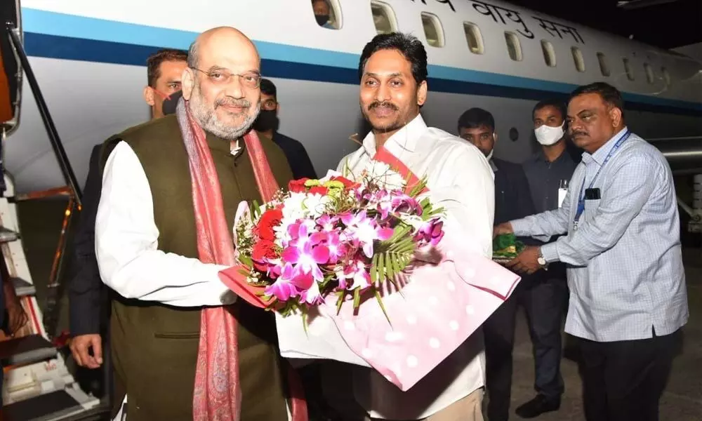 Chief Minister Y S Jagan Mohan Reddy receiving Union Home Minister Amit Shah at Tirupati airport on Saturday