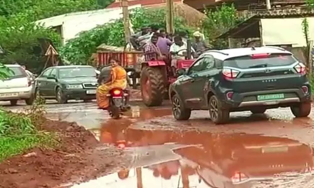 Be careful when you are driving on this potholed road