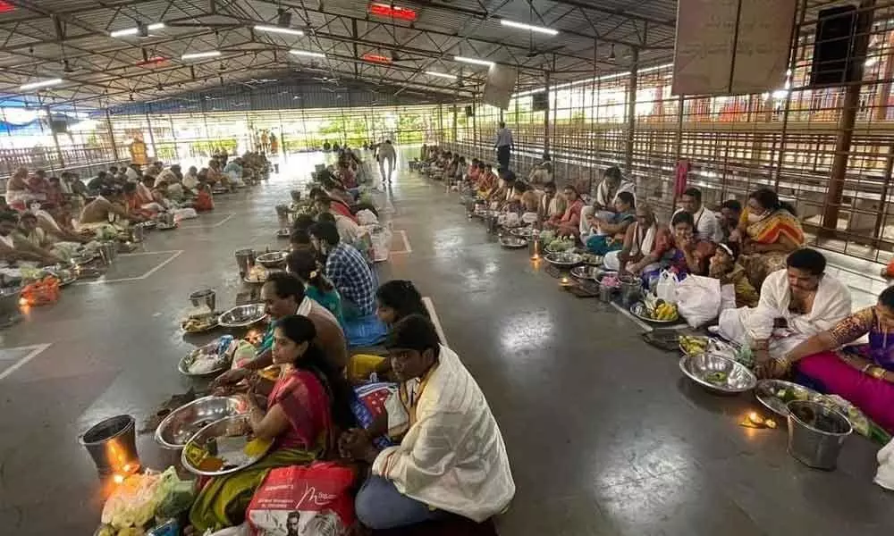 Devotees taking part in Satyanarayana Swamy Vratam at Shivalayam in Vizianagaram on Monday