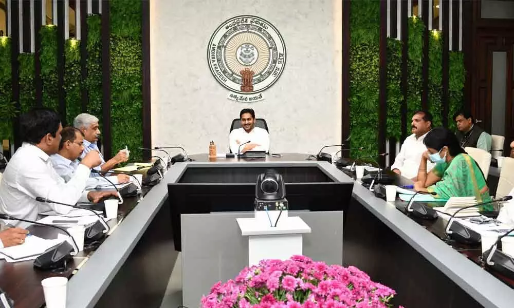 Chief Minister Y S Jagan Mohan Reddy holding a review meeting on road repairs and restoration at his camp office in Tadepalli on Monday