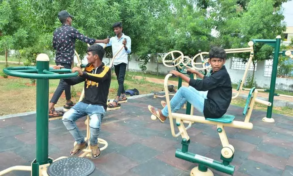 Youth doing exercises in an open gym located at Shivaji Nagar Park in Nalgonda town