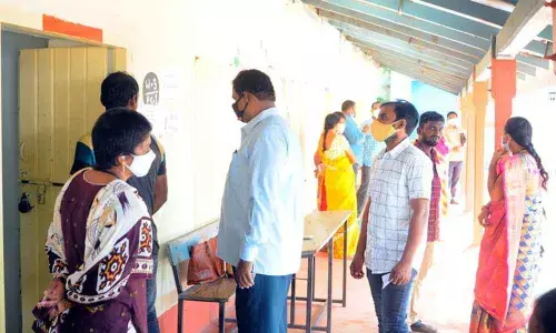 Voters queuing up to cast their votes in Kondapalli near Vijayawada on Monday