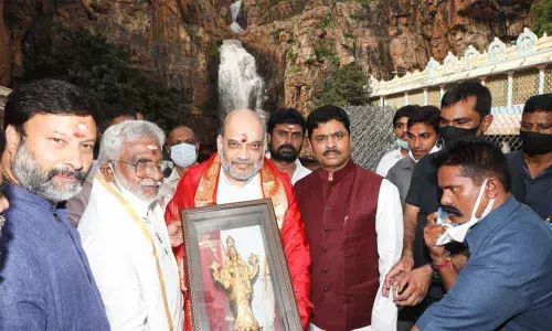 TTD Chairman Y V Subba Reddy and EO Dr K S Jawahar Reddy presenting laminated photo of Lord to Union Home Minister Amit Shah at Kapilatheertham in Tirupati on Monday.