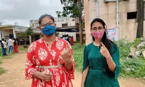 Young girls showing their indelible ink mark after exercising their franchise in Kuppam local body poll  on Monday