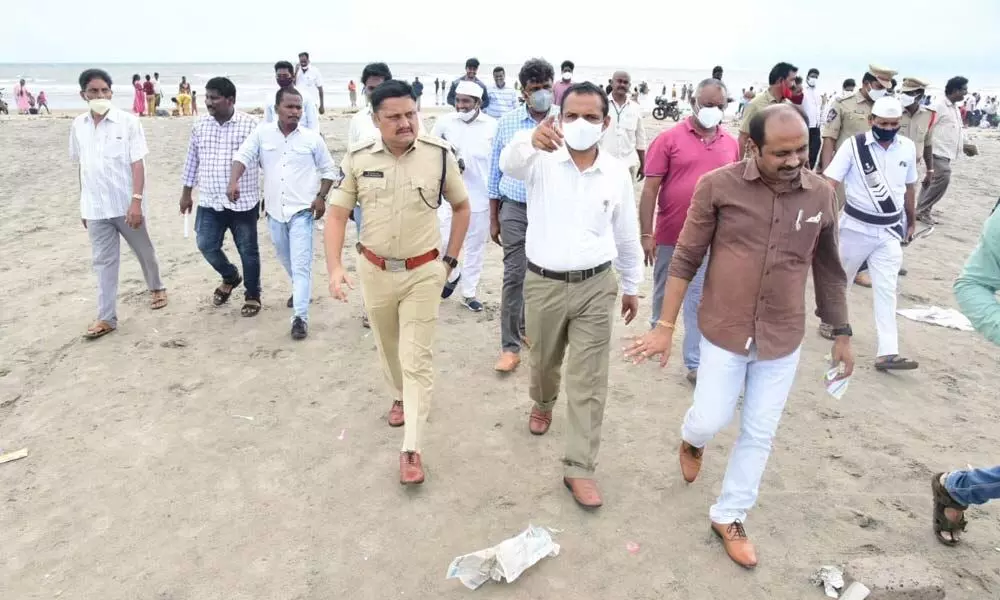 Bandar Revenue Divisional officer N Khajavali, DSP Masum Basha and other officials at the beach near Machilipatnam in Krishna district on Tuesday