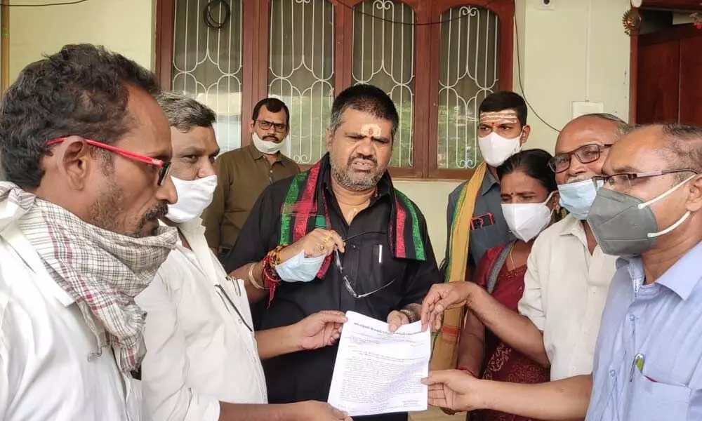 CITU leaders submitting a representation to Tourism Minister M Srinivasa Rao in Visakhapatnam on Tuesday
