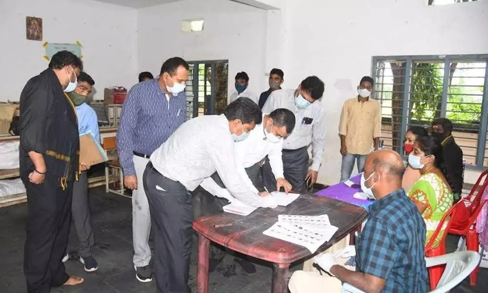 District Collector A Mallikarjunainspecting polling process at a polling station in Anandapuram mandal in Visakhapatnam on Tuesday
