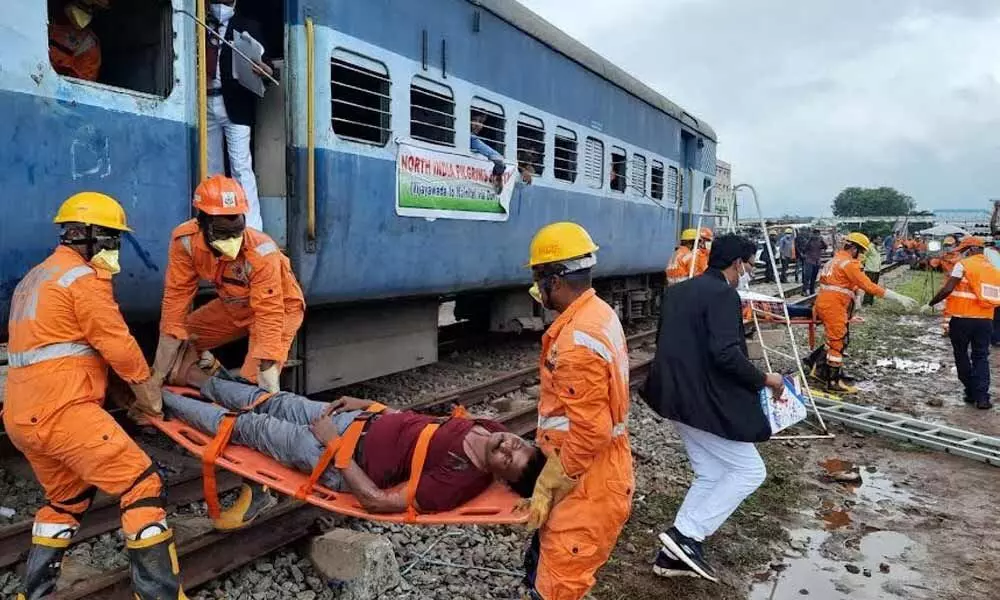 Mock rescue and relief operations carried out at Simhachalam station yard by Waltair division in Visakhapatnam on Tuesday