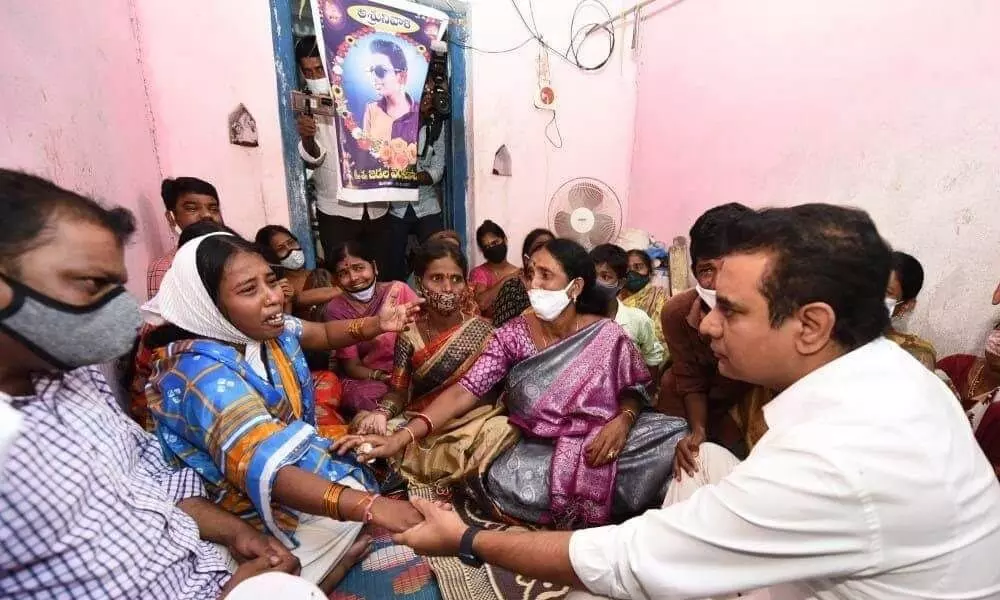 Minister KT Rama Rao consoling the family members of students, who drowned in Manair check dam, in Sircilla on Wednesday