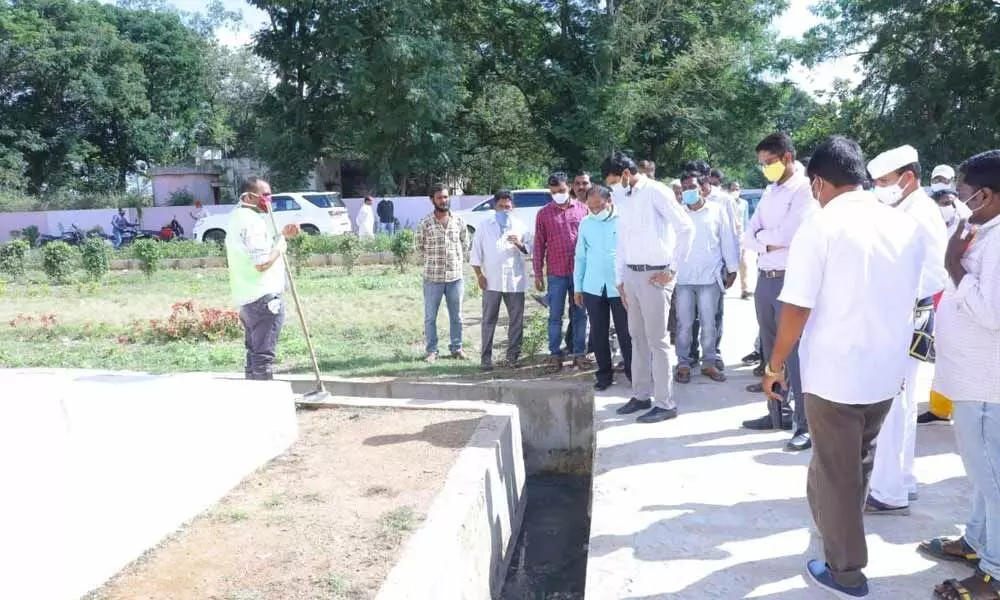 District Collector VP Gowtham observing the drainage system at double bedroom houses colony at Tekulapally on Wednesday