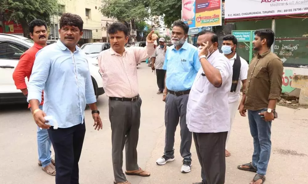 Municipal Commissioner P S Girisha inspecting the low-lying areas to alert civic staff in the wake of cyclone alert, in Tirupati on Wednesday