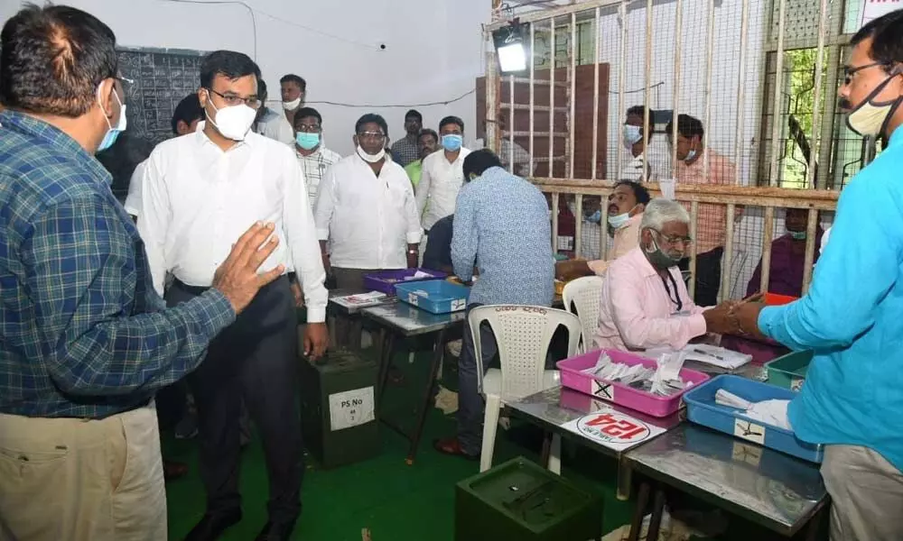 District Collector K V N Chakradhar Babu inspecting the counting process at DKW College in Nellore on Wednesday