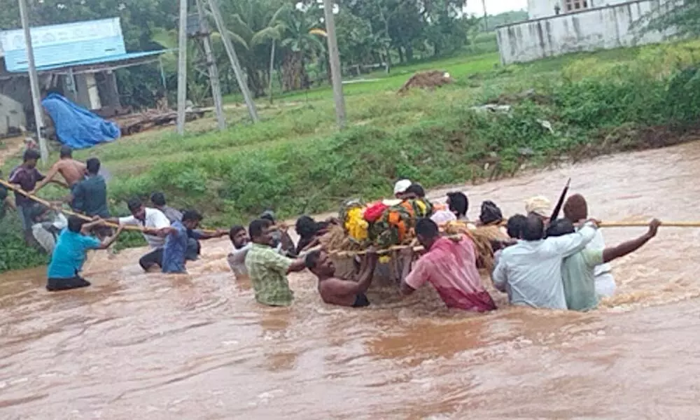 People carrying dead body crossing Swarnamukhi, near mullapudi village Tirupati rural