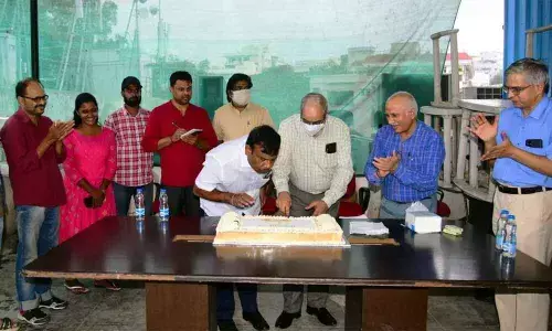 The Hans India Editor V Ramu Sarma cutting the cake, while Bizz Buzz Editor P Madhusudhan Reddy blowing off the candle during first anniversary celebrations of Bizz Buzz business e-daily int Hyderabad on Thursday. K Hanumanta Rao (2nd from right), Managing Director, Hyderabad Media House, seen clapping Photo: Srinivas Setty
