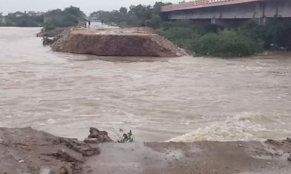 Kadapa: A priest along with family members washed away in the flood water