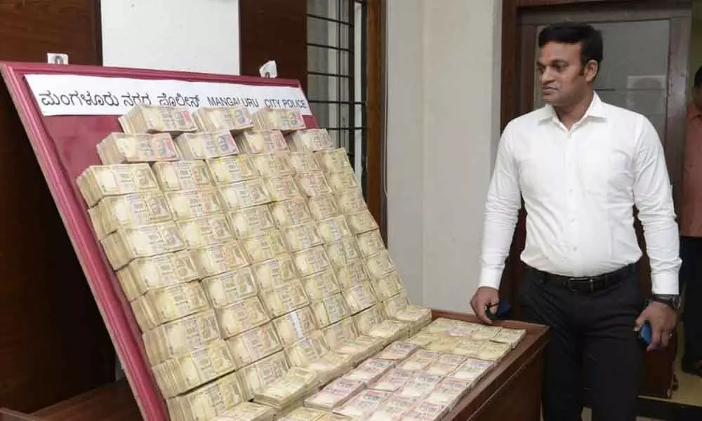 Mangaluru police arrested three persons on Friday and recovered banned currency notes with a total face value of Rs 1.92 crore