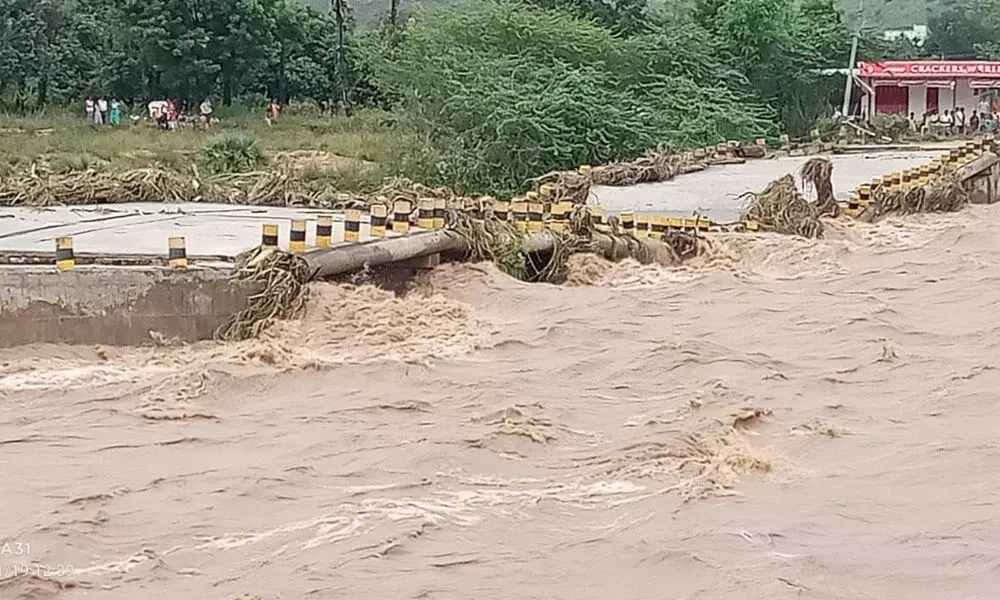 The bridge on Swarnamukhi river at Chiguruvada in Tirupati rural mandal washed away due to flood on Friday morning