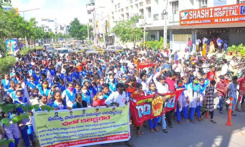 Students staging a protest against the government in Khammam on Monday