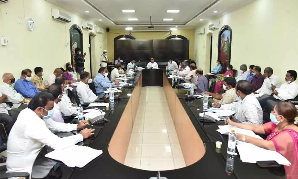 District Collector Vivek Yadav addressing a review meeting in Guntur on Friday