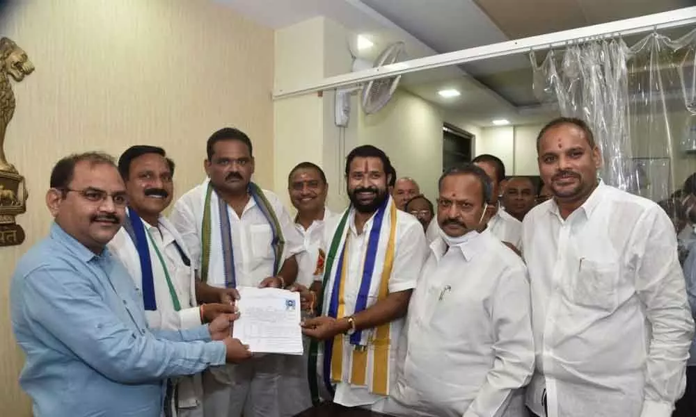 I Raghu Raju submitting nomination papers to Returning Officer and Joint Collector GC Kishore in Vizianagaram on Monday
