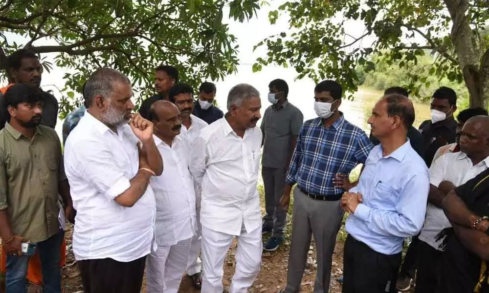 Panchayat Raj Minister Peddireddi Ramachandra Reddy, MLA Chevireddy Bhaskar Reddy, MP Reddeppa and Collector M Hari N arayanan visit the Rayala Cheruvu at Ramachandrapuram in Tirupati on Monday