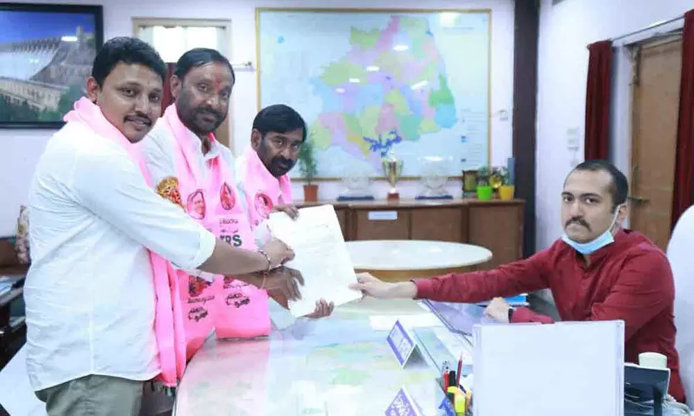 TRS candidate MC Koti Reddy along with Minister Jagadish Reddy and MLA N Bhagath submitting his nomination to district Collector Prashanth Jeevan patil in Nalgonda on Tuesday