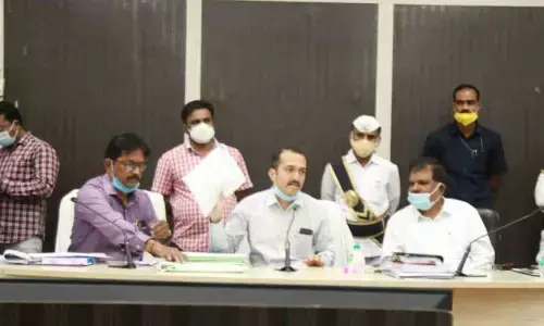 District Collector Prashanth Jeevan Patil along with additional Collector Vanamala Chandrasekhar scuritinising the local body MLC election nominations at district Collectorate in Nalgonda on Wednesday
