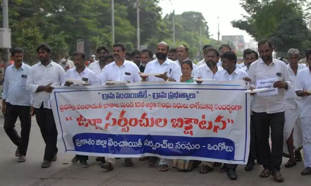 Members of the Prakasam district Sarpanches Association doing a bhikshatana in Ongole on Thursday