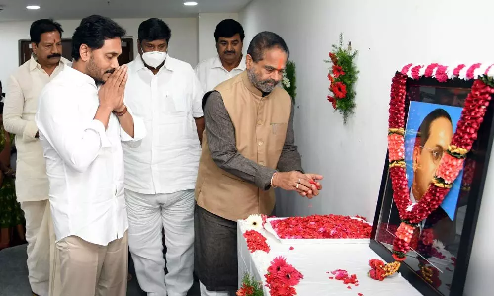 Chief Minister YS Jagan Mohan Reddy and  State Assembly Speaker Tammineni Sitaram paying tributes to Dr B R Ambedkar at the committee hall  in the Assembly at Velagapudi on Friday on the occasion of the Constitution Day