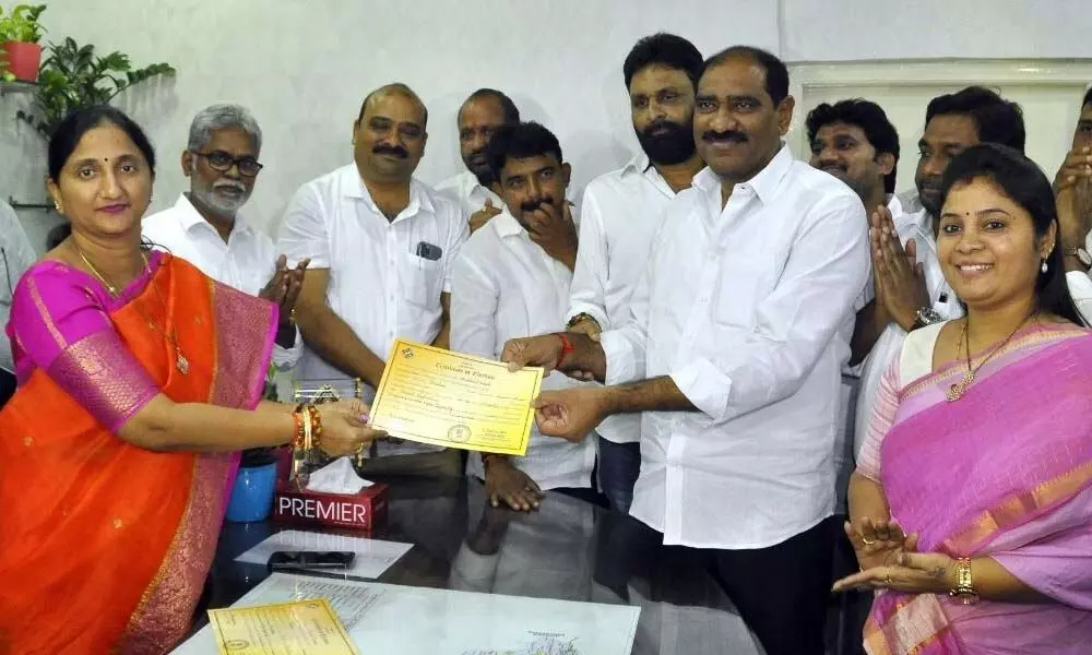 Talasila Raghuram receiving the certificate of election from Joint Collector Dr K Madhavilatha on Friday