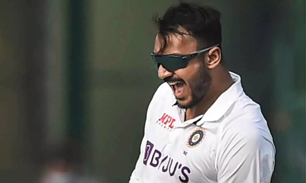 Indian bowler Axar Patel celebrates the dismissal of New Zealand batsman Tom Blundell during third day of the first Test cricket match between India and New Zealand, at Green Park stadium in Kanpur on Saturday