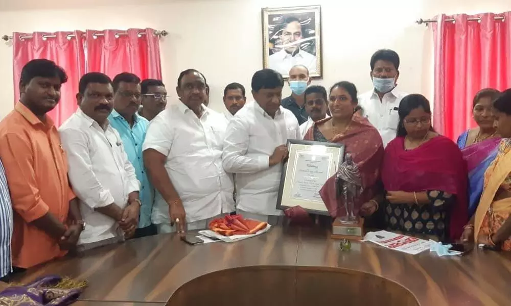 Municipal Chairman Akula Rajitha Venkat being felicitated in Husnabad on Saturday