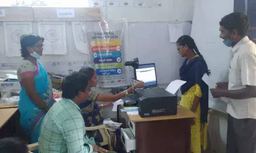 Village and ward secretariat staff receiving petition in China Bondapalli