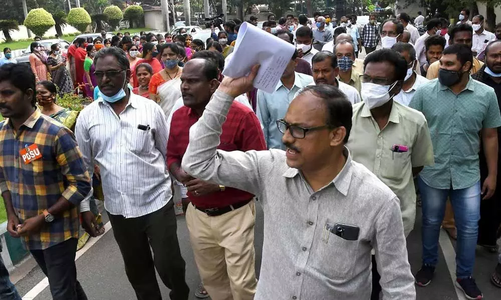 Dr NTR University of Health Sciences employees protest against transfer of university funds to the government, on the university premises in Vijayawada on Monday	 (Photo: Ch Venkata Mastan)