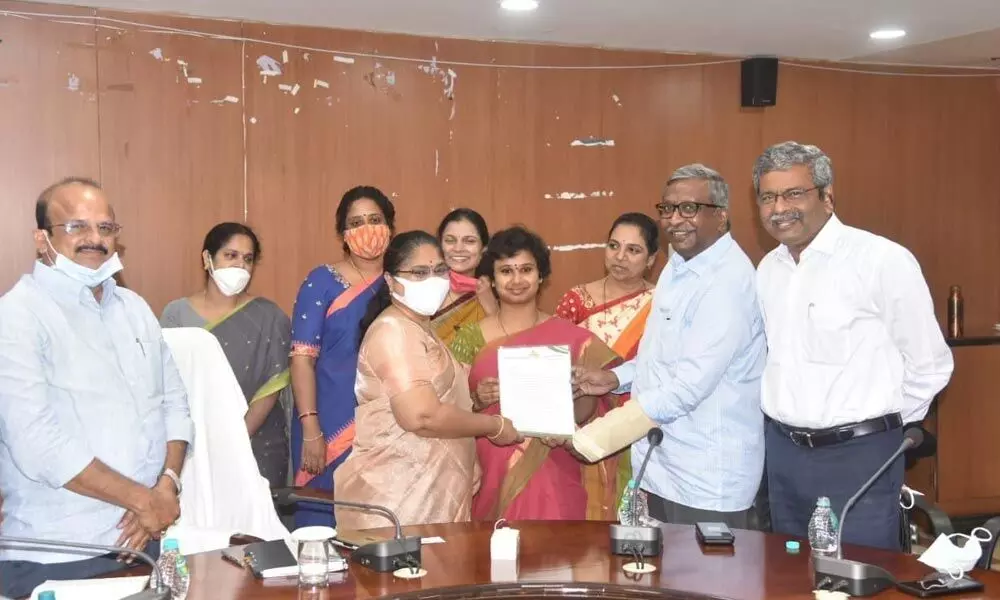 Entrepreneurs submitting petition to District Collector ASuryaKumari for resolving their problems in Vizianagaram on Wednesday