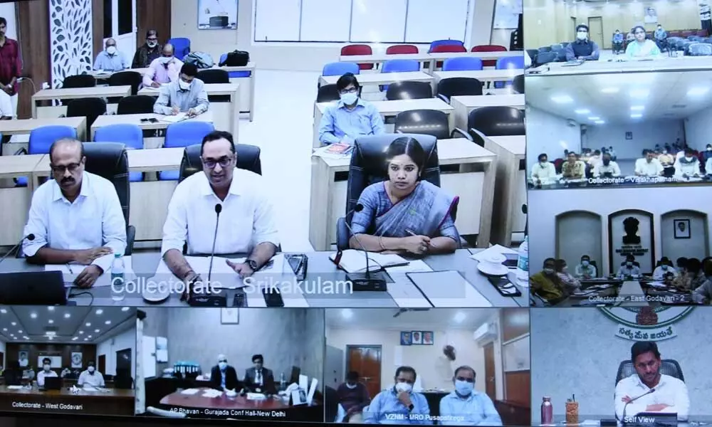 Chief Minister Y S Jagan Mohan Reddy addresses district collectors of cyclone-prone districts through videoconference in his camp office  in Tadepalli on Friday