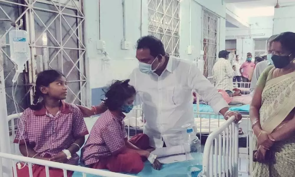 Choppadandi MLA Sunke Ravishankar enquiring the students about their health at Government Hospital in Karimnagar on Friday