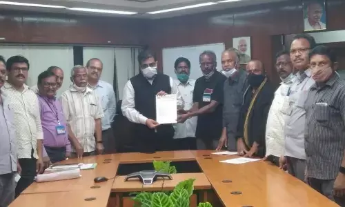 Representatives of recognised union serving a strike notice to the CMD of RINL Atul Bhatt in Visakhapatnam on Friday