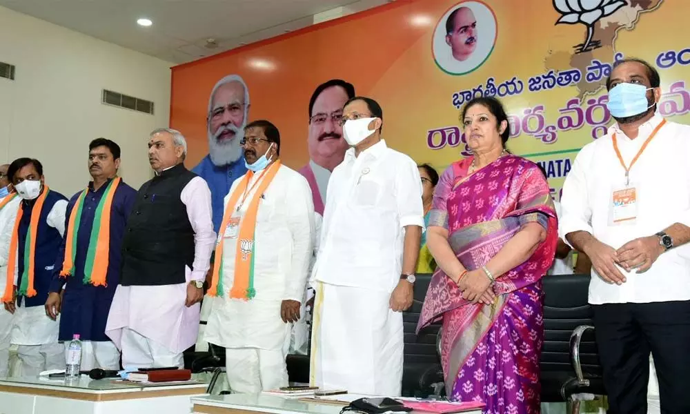 Union minister V Muraleedharan (third from right), party state president Somu Veerraju, national leaders Daggubati Purandeswari, Y Satya Kumar and others at the BJP state executive commitee meeting in Vijayawada on Saturday
