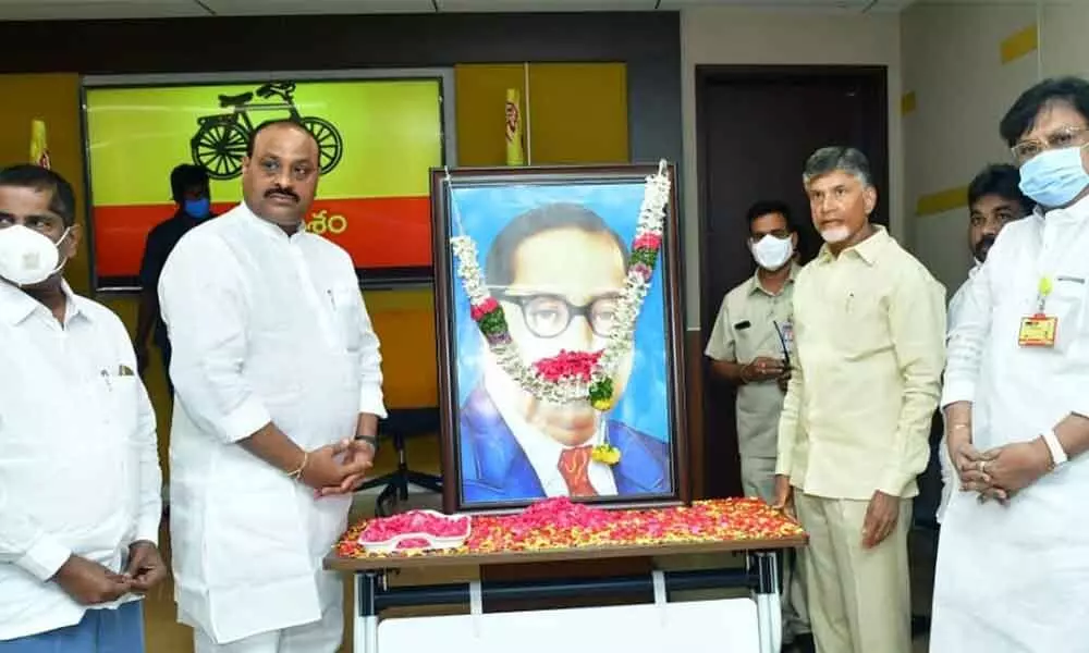 TDP national president N Chandrababu Naidu, party AP unit president K Atchannaidu and other leaders pay floral tributes to B R Ambedkar on his  death anniversary at  NTR Bhavan in Mangalagiri on Monday