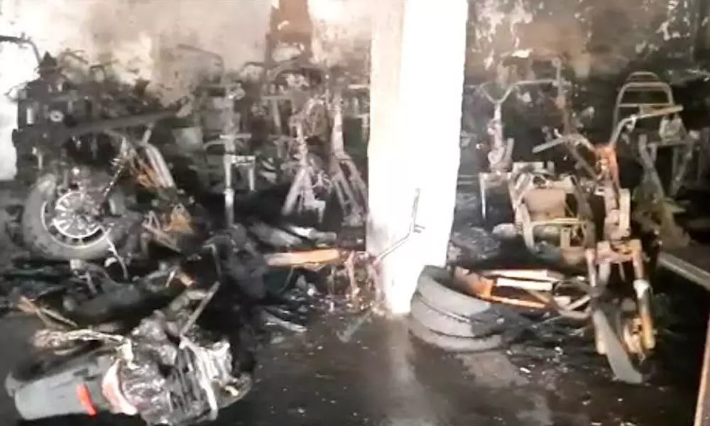 Two-wheelers burnt at an automobile agency in Gajuwaka in Visakhapatnam on Tuesday