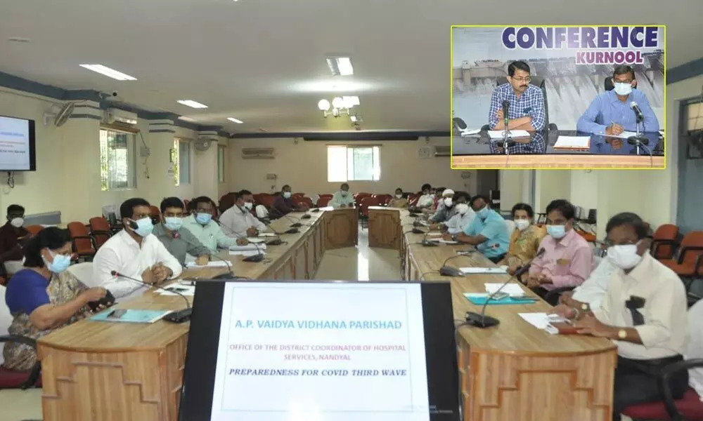 District Collector P Koteswara Rao holding a review meeting on Covid at the Collectorate in Kurnool on Tuesday. Joint Collector Rama Sunder Reddy is also seen.